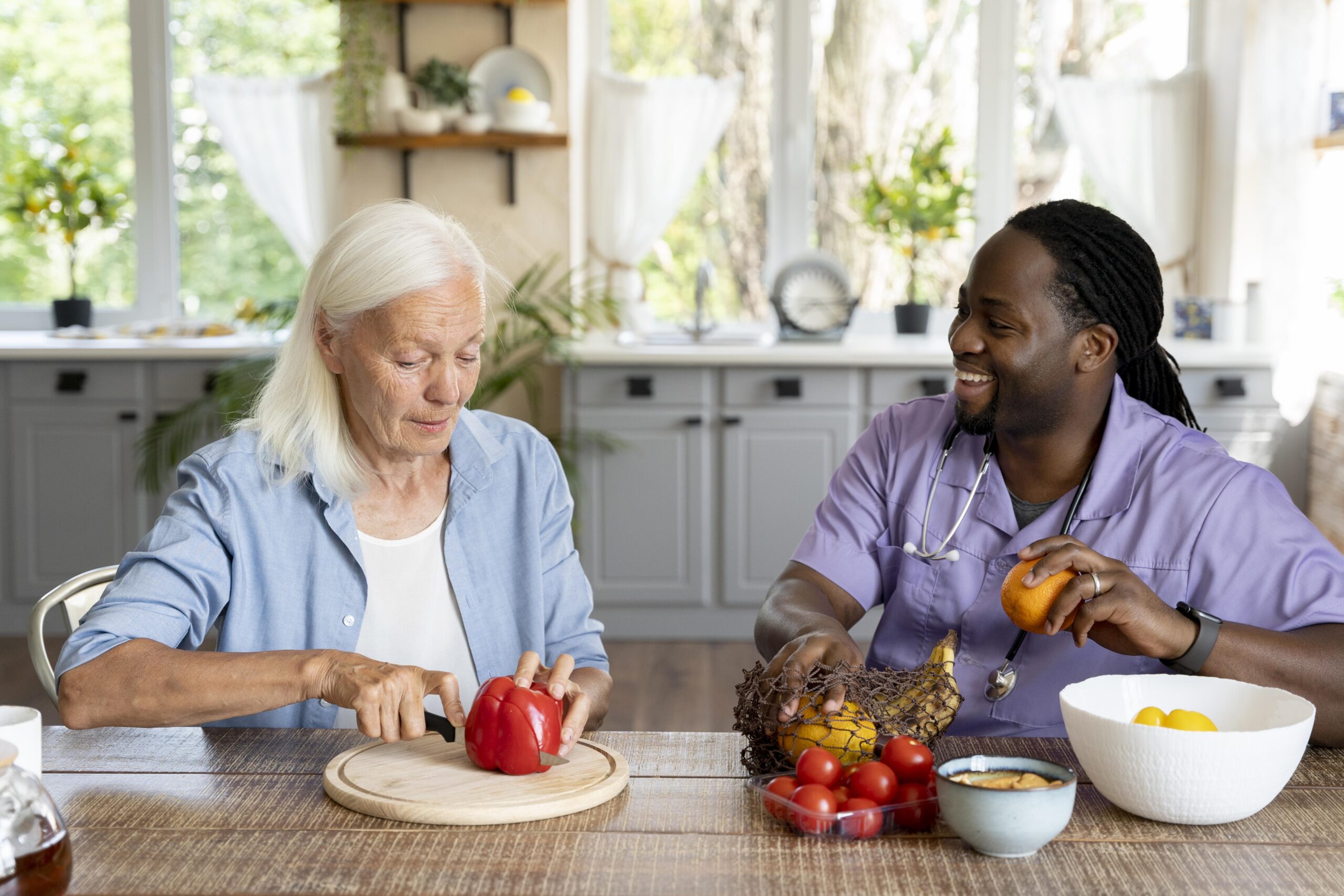 social-worker-making-food-with-senior-woman